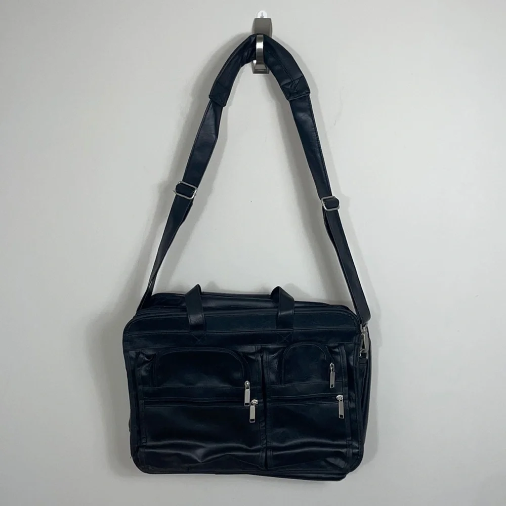 Soft bodied faux leather briefcase lots of pockets and crossbody strap